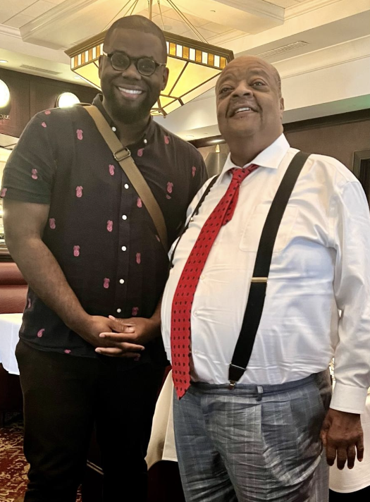 Jeremy Q. Henry standing with Bishop Sedgwick Daniels at a restaurant