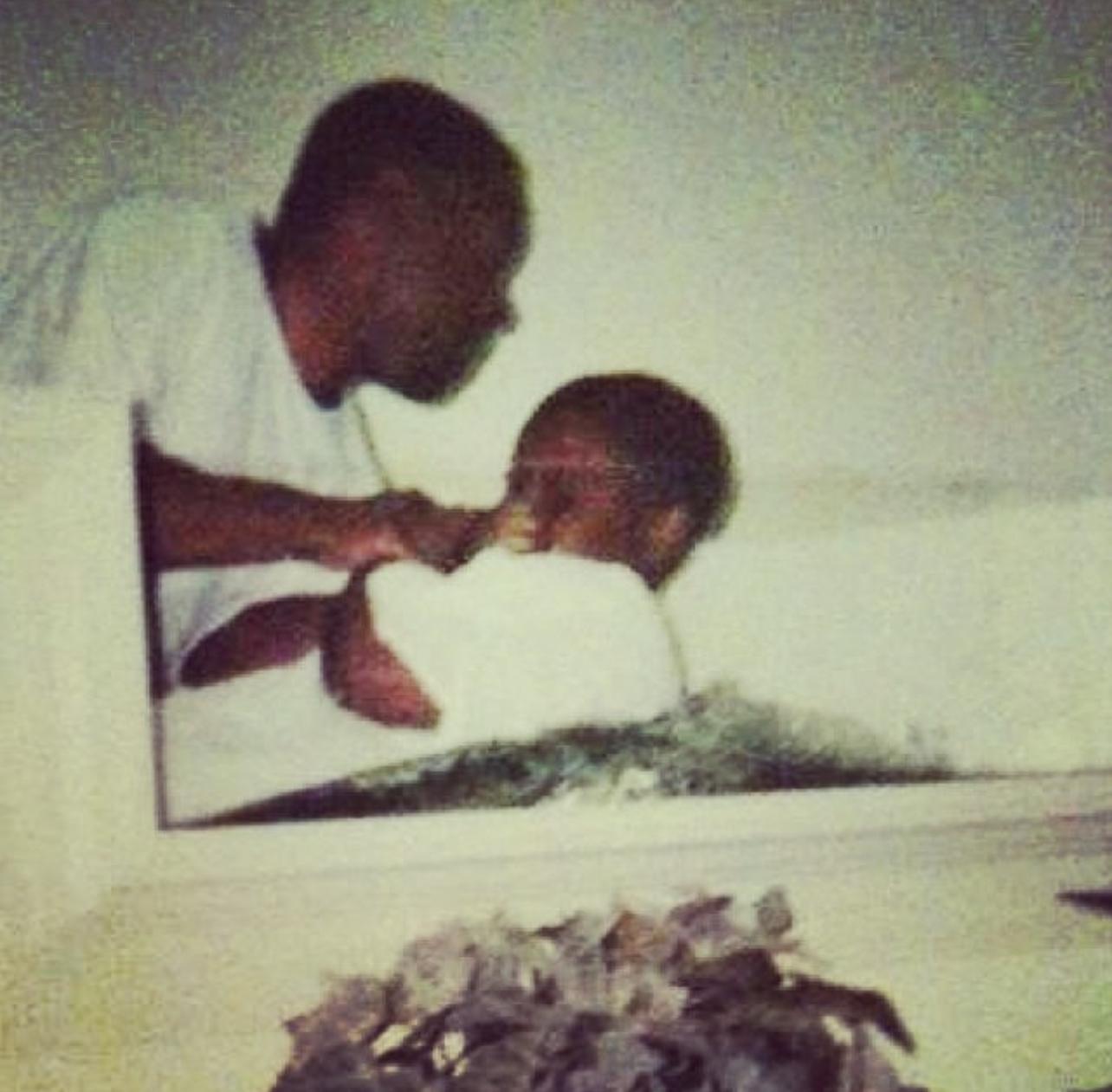 Vintage photograph of a child being blessed at a baptismal service